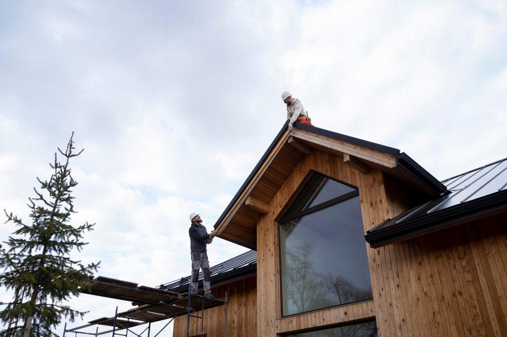 long shot men working roof together 23 2149343676 1024x682 1